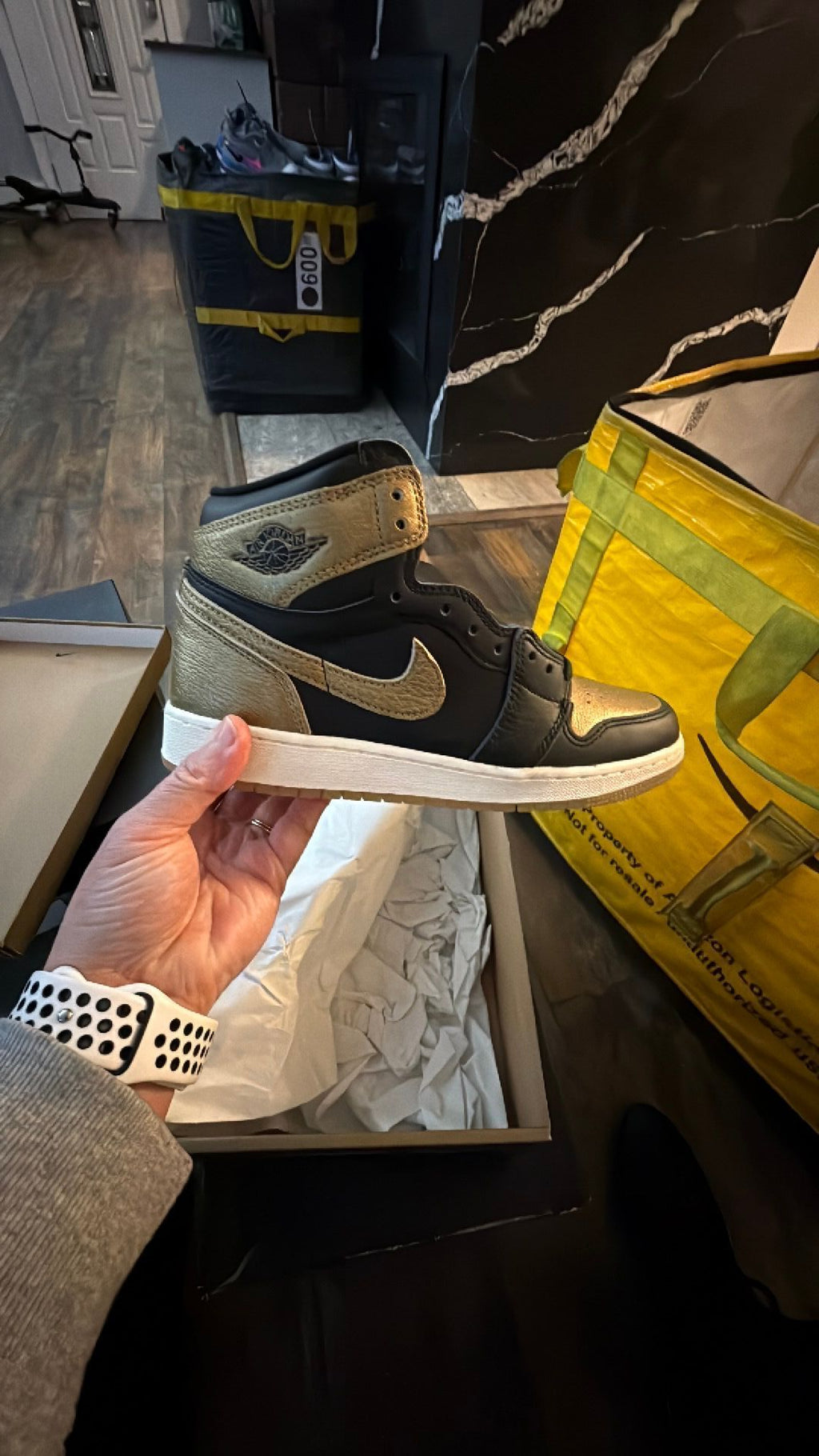 0344 Nike Air Jordan 1 Retro High OG in the black and metallic gold colorway