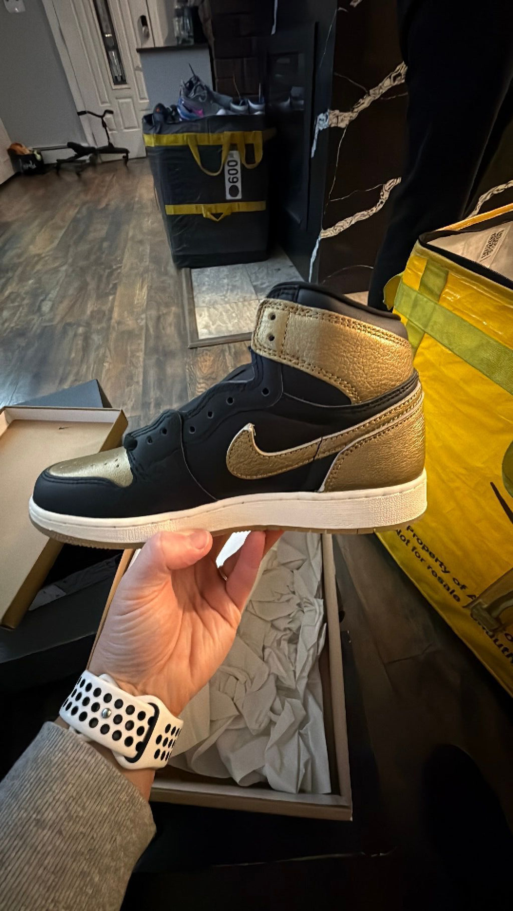 0344 Nike Air Jordan 1 Retro High OG in the black and metallic gold colorway
