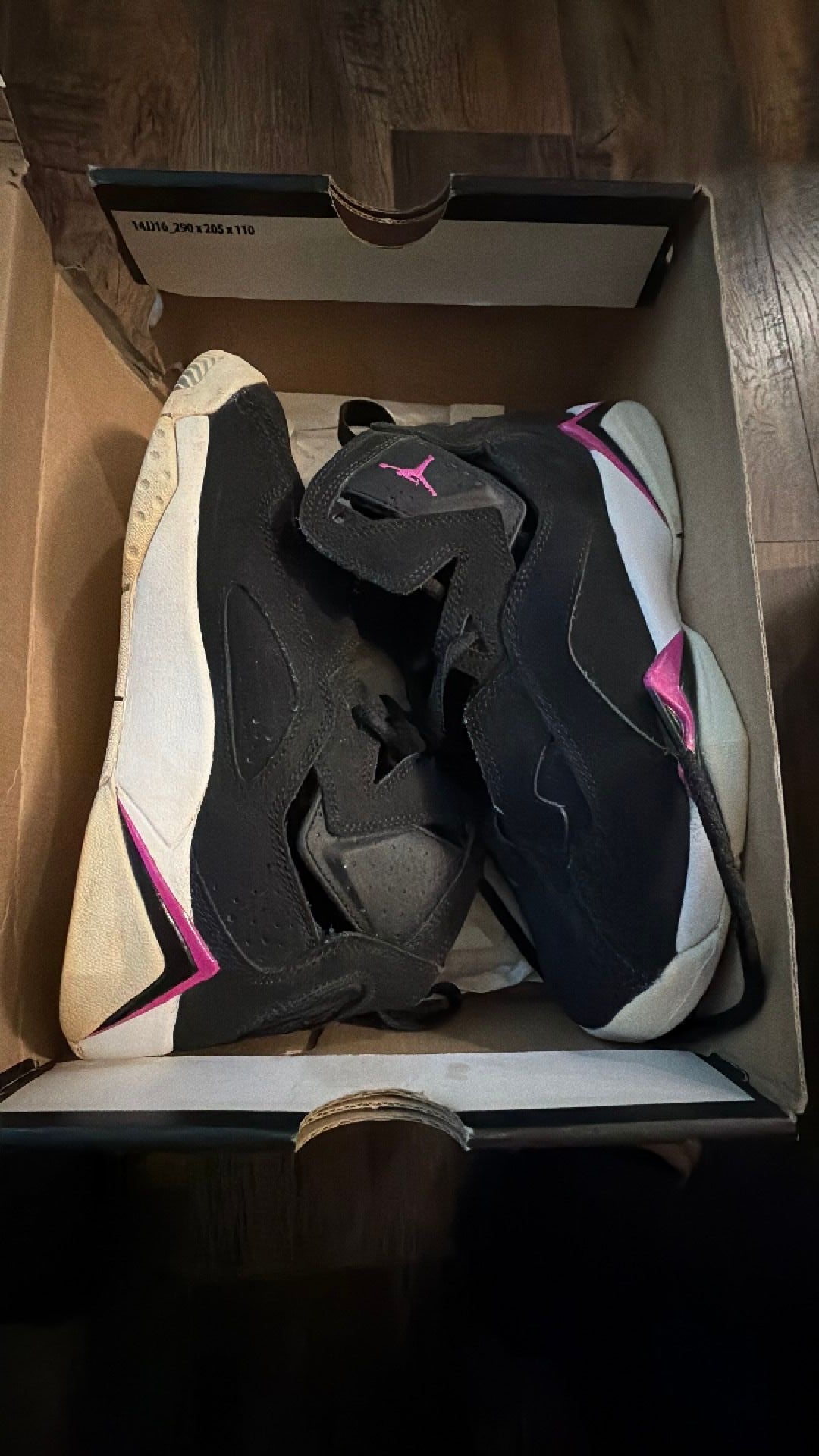 0588 Air Jordan True Flight sneakers in a black, white, and fuchsia blast colorway