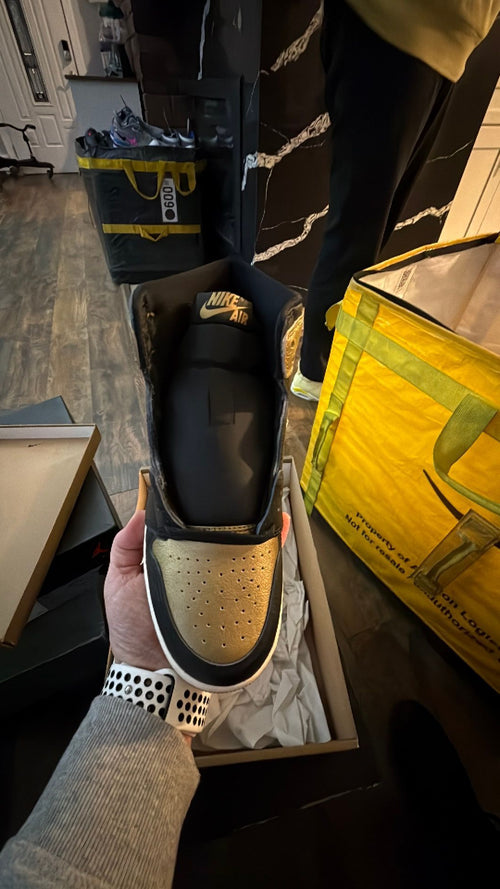 0344 Nike Air Jordan 1 Retro High OG in the black and metallic gold colorway
